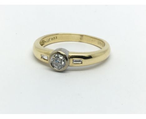 An 18ct gold solitaire diamond ring with diamonds to the shoulders, approx.25ct, approx 4.3g and approx size P.