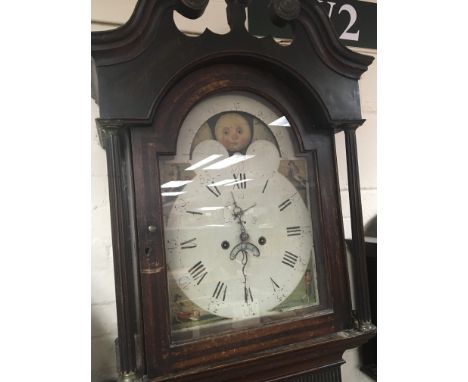 An Early Victorian long case clock with a painted dial and moon roller swan neck pediment. eight day going.
