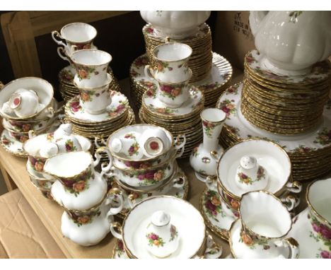 A large Royal Albert Old Country Roses dinner service including plates, cups, saucers, tureen, tea and coffee pots, table mat