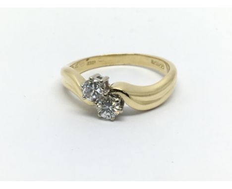 An 18ct gold two stone diamond ring, approx 1/2ct, approx 3.9g and approx size N.