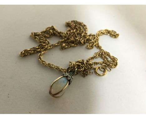 A 9carat gold rope chain weight 6g with an attached opal pendent (opal cracked)