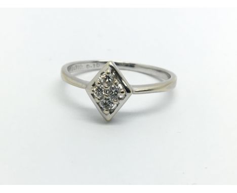 An 18ct white gold four stone diamond ring, approx.10ct, approx 1.7g and approx size K.