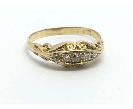 A vintage 18ct gold five stone diamond ring, approx 1.7g and approx size M.