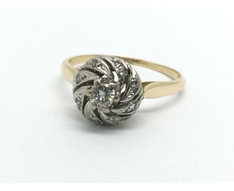 An 18ct gold diamond swirl ring, approx.15ct, approx 2.7g and approx size L.