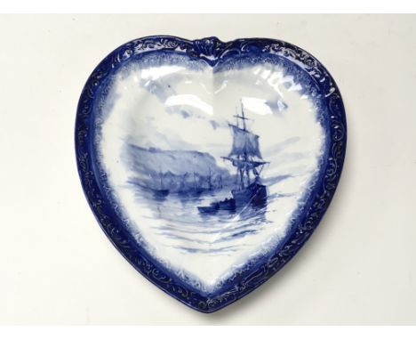 A Royal Crown Derby heart shaped plate decorated in blue and white ship scene by W.E.J. Dean