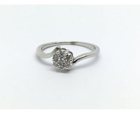 An unmarked white gold seven stone diamond ring, approx 1.4g and approx size K.