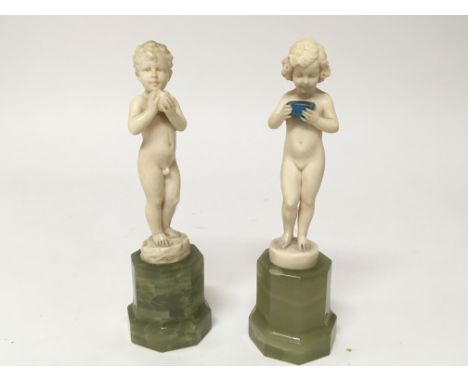 A Quality pair of Art Deco K Preiss carved ivory figures of a nude boy and girl. on polished green onyx bases signed F. Preis