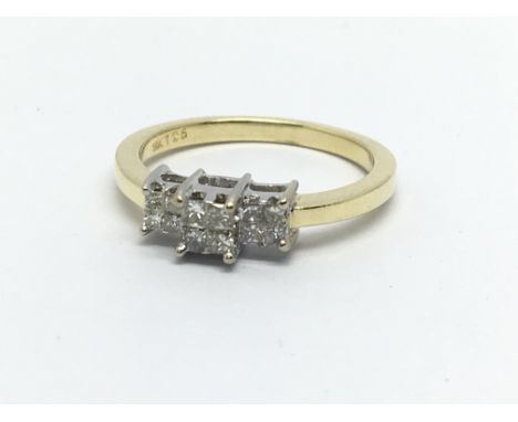 An 18ct gold ring set with twelve princess cuts, approx 3.5g and approx size M.