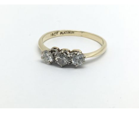 An 18ct and platinum three diamond ring, approx 1.7g and approx size L-M.