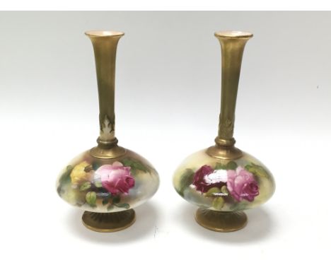 A pair of Royal Worcester fluted vases depicting roses