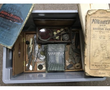 A box containing a collection of oddments including a cased set of weighing scales, maps, etc