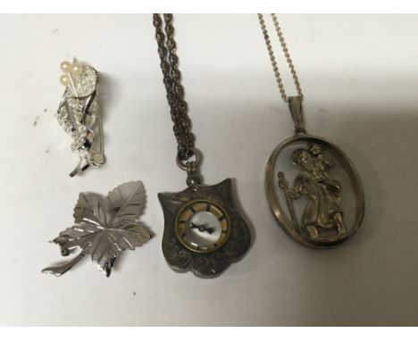 A silver pendent inset with a compass Chester hallmarks and other silver jewellery.