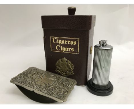 A table lighter in the form of a column, a leather military cigar box and an inkwell blotter