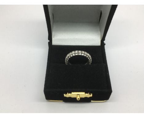 An 18ct white gold eternity ring, approx 2.8g and approx size J.