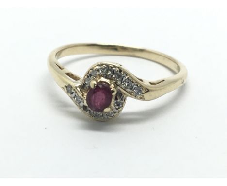 A 9ct gold ruby and diamond swirl ring, approx 1.6g and approx size M-N.