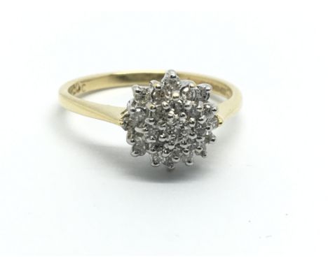 An 18ct gold diamond cluster ring, approx 3.2g and approx size M.