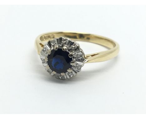 An 18ct gold sapphire and diamond cluster ring, approx 3g and approx size L.