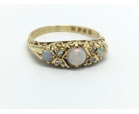 An 18ct gold opal and diamond ring, approx 4g and approx size N.