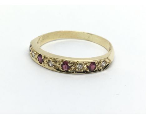 An 18ct gold ruby and diamond half eternity ring, approx 2.3g and approx size N-O.