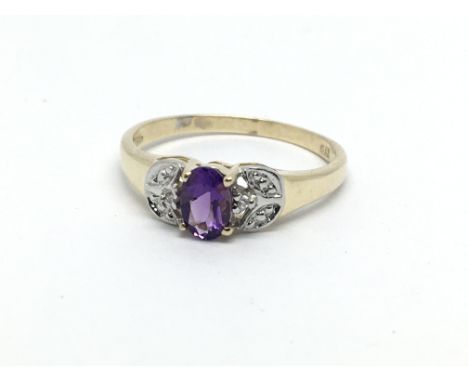 A 9ct gold amethyst and small diamond ring, approx 1.6g and approx size N.