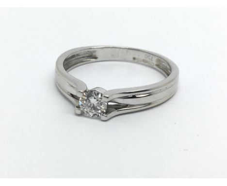 An 18ct white gold solitaire diamond ring, approx.20ct, approx 2.1g and approx size K.