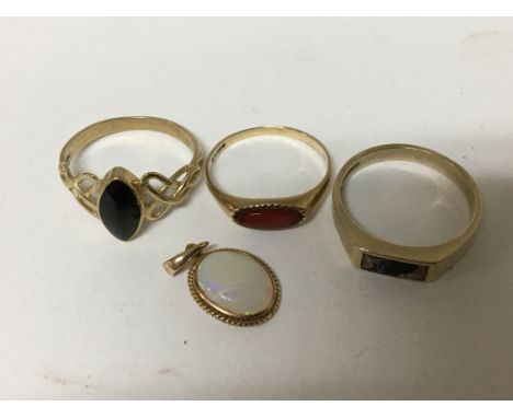 Three gold rings inset with polished stones and an opal pendent in a gold mount 6g