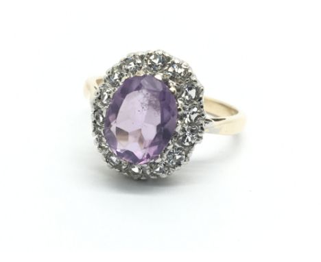 A 9ct gold amethyst and clear spinel ring, approx 3.7g and approx size N.