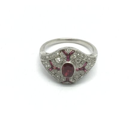 A platinum Victorian style ruby and diamond ring in a filigree style mount, approx 5.3g and approx size N.