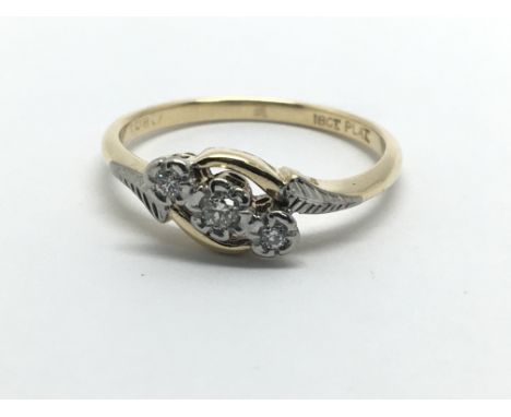 An 18ct gold and platinum three stone diamond ring, approx.10ct, approx 2.5g and approx size M.