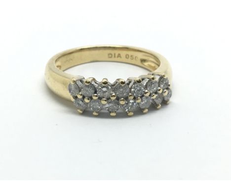 An 18ct gold ring set with 14 diamonds, approx 1/2ct, approx 4.6g and approx size K-L.