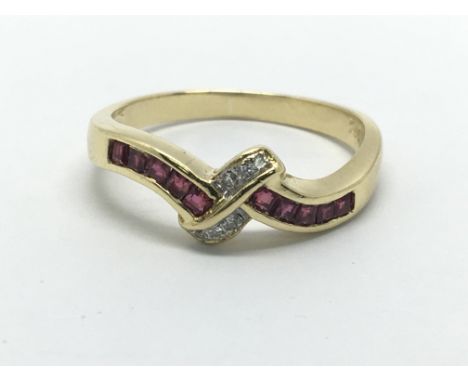 An 18ct gold ruby and diamond ring, approx 3g and approx size L-M.