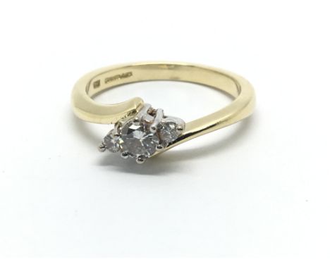 An 18ct gold three stone diamond ring, approx.25ct, approx 3.2g and approx size K-L.