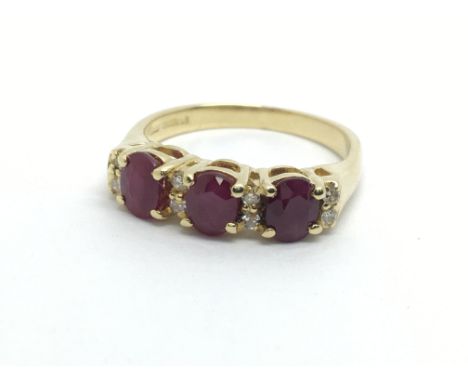 An 18ct gold ruby and diamond ring, approx 3.9g and approx size L.