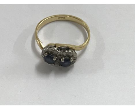 A 18 ct gold ring inset with sapphires Size M Total weight 4 grams.