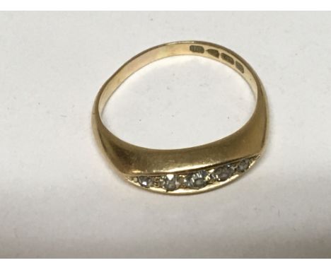 An 18carat gold ring set with a row of five diamonds ring size M.