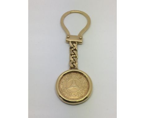 A 9ct gold Mercedes key ring, approx 14.7g.