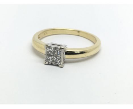 An 18ct gold diamond ring set with four princess cut diamonds, approx .20ct, approx 2.9g and approx size L-M.