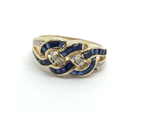 A gold sapphire and diamond swirl ring, approx 3.8g and approx size N.