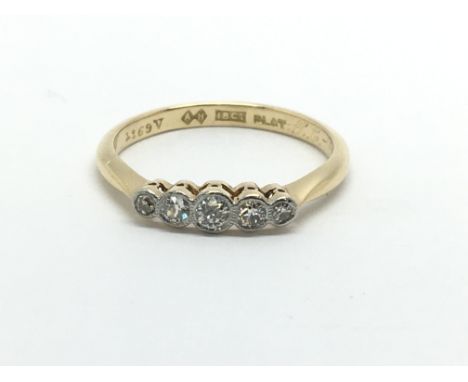 An 18ct gold and platinum five stone diamond ring, approx.12ct, approx 2.3g and approx size M.