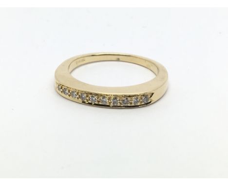 An 18ct gold half eternity ring, approx .12ct, approx 3.3g and approx size K.