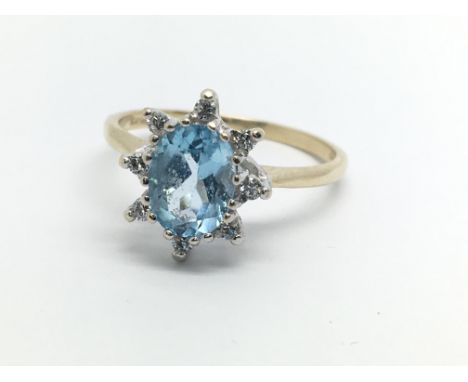 A 9ct gold topaz and diamond cluster ring, approx 2.4g and approx size O.