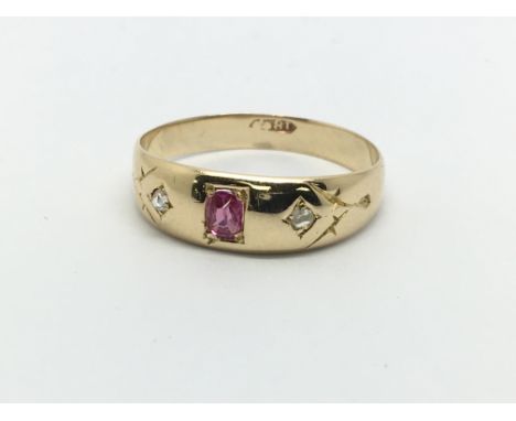 A vintage 18ct gold ruby and two diamond ring, approx 2.3g and approx size N.