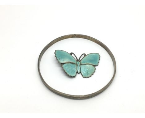 A sterling silver bangle by Charles Horner and an enamelled sterling silver butterfly brooch (2).