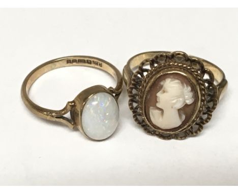 Two 9carat gold rings one set with a cameo the other with an opal (2)