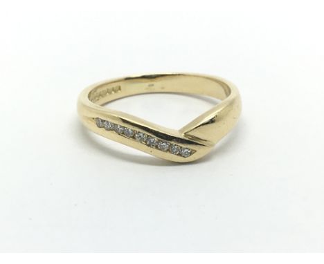 An 18ct gold nine stone diamond ring, approx .10ct, approx 3.3g and approx size K-L.