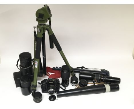 A box containing a collection of camera and photographic equipment including a Canon A-1 SLR with 50mm f1.4, plus other Canon