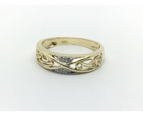 A 9ct gold open work ring set with small diamonds, approx 2.2g and approx size N.