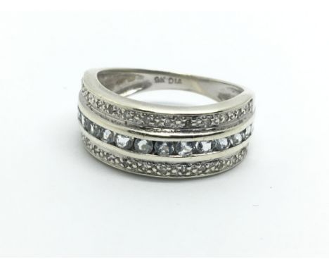 A 9ct white gold set with three rows of diamonds and aquamarines, approx 3.7g and approx size K-L.