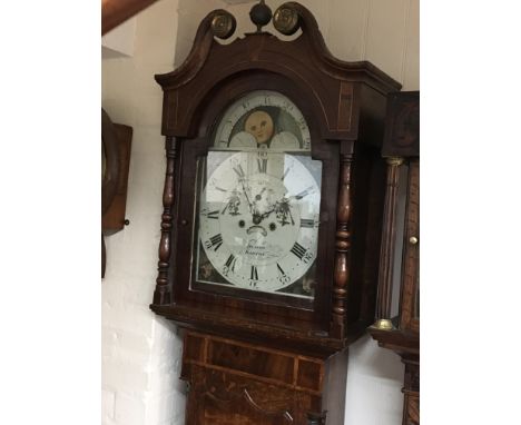 A 19th century inlaid oak  longcase clock with a painted dial maker Deacon Barton with an eight day going movement striking o