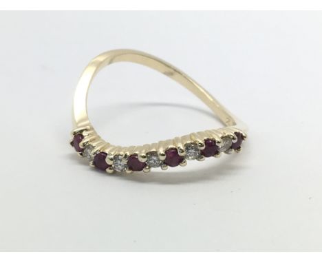 A 14ct gold ruby and diamond twist ring, approx 2g and approx size O-P.